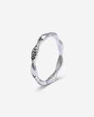 Poisson silver fish ring on off white background