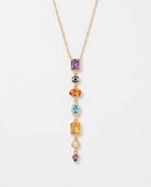 Celeste colourful gemstone drop gold necklace on soft studio background